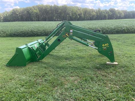 skid steer self leveling bucket|john deere skid steer leveling.